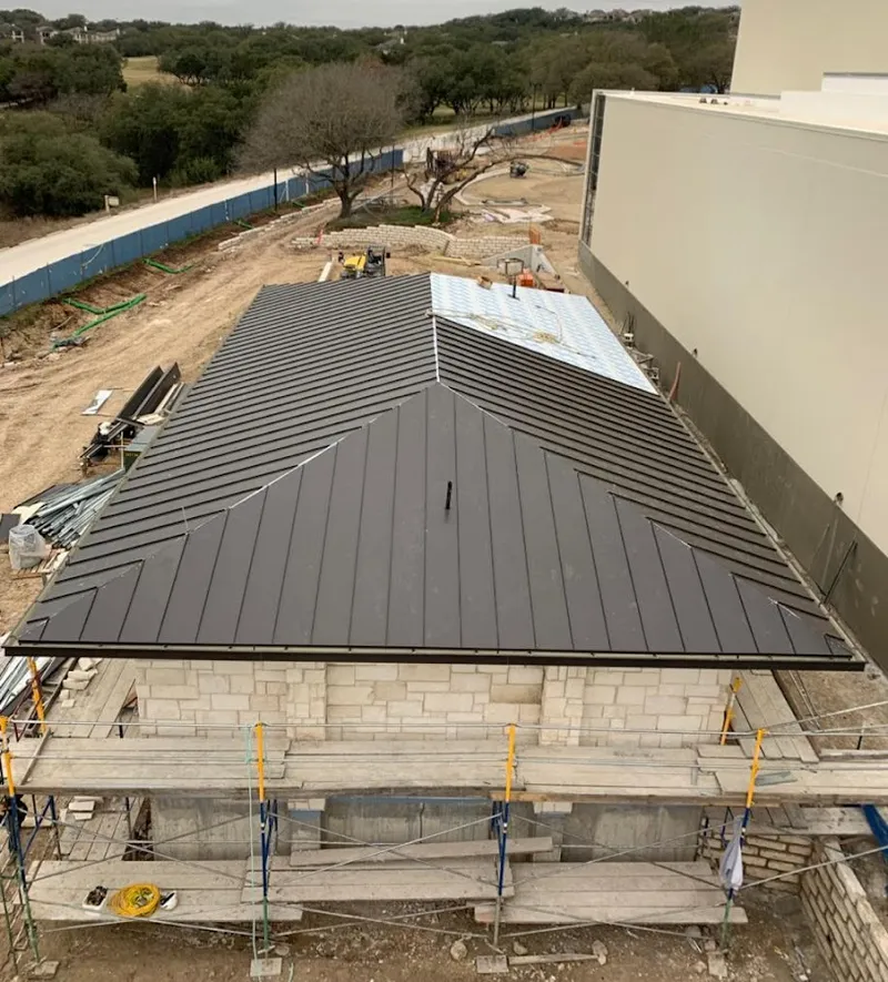 Metal roof new construction with scaffolding in Dickinson